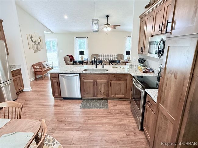 Kitchen with open access to family room, great cooking space and cabinets are solid. | Image 7