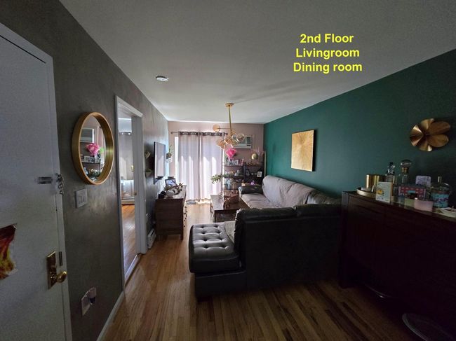 Living room featuring wood finished floors | Image 11