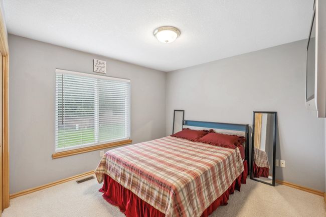 Carpeted bedroom featuring baseboards | Image 14