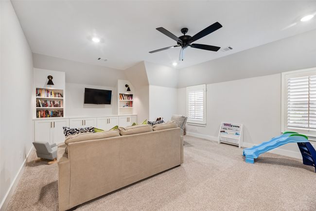 Living room with baseboards, carpet floors, ceiling fan, and recessed lighting | Image 29