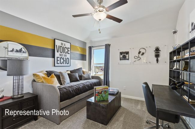Carpeted living room featuring lofted ceiling, baseboards, and ceiling fan | Image 19