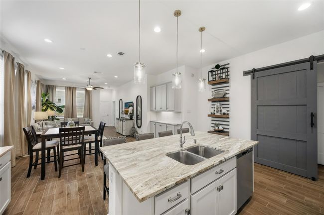 The adjoining dining area is the perfect spot to start your day, offering enough room for both casual meals and family gatherings. | Image 11