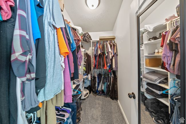 Walk in closet with carpet floors | Image 16