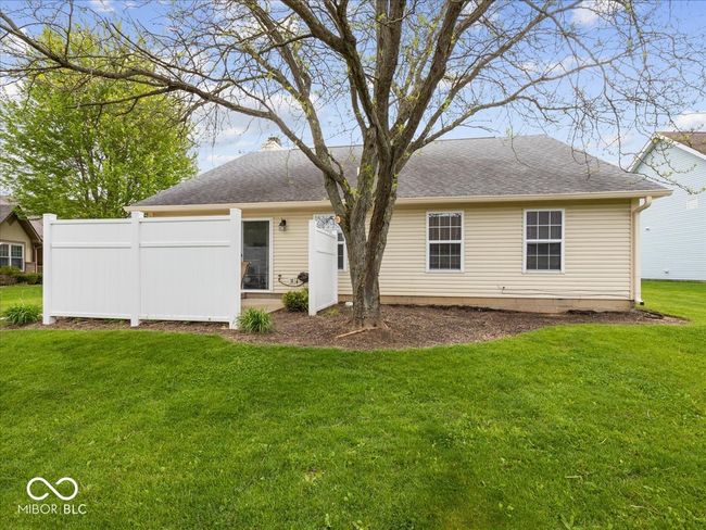 rear view of house featuring privacy panels for back patio | Image 20
