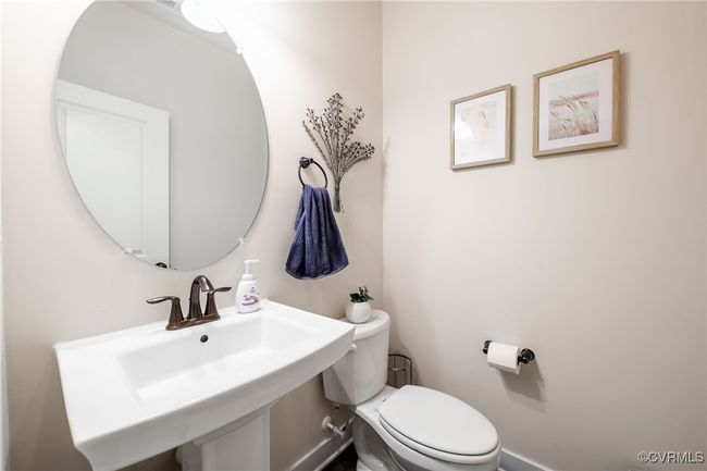 Half bath with a sink and toilet | Image 4