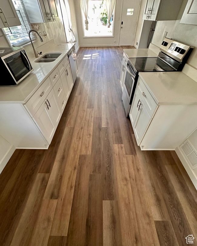 This photo shows the updated flooring throughout upper floor. | Image 4