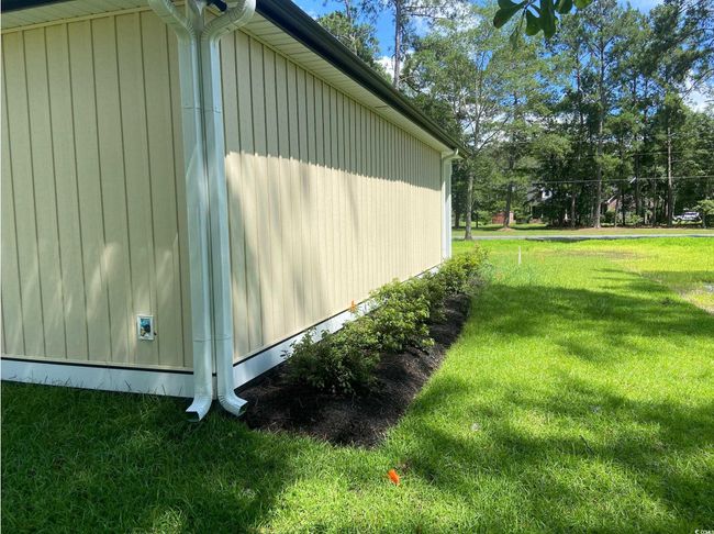 View of side of property with a lawn | Image 7