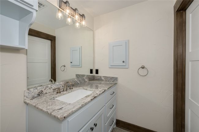 Bathroom with vanity and baseboards | Image 33
