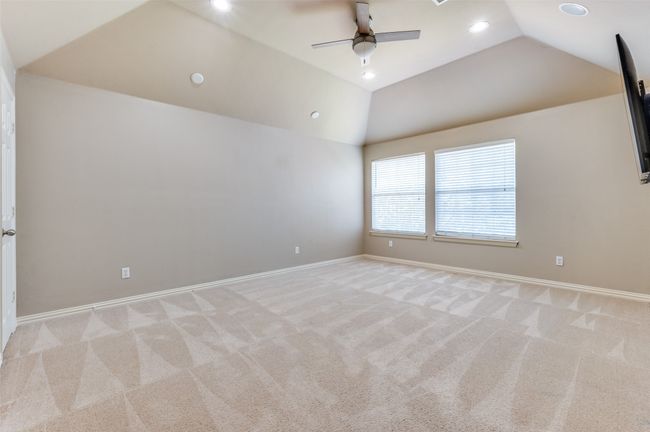 Game Room with vaulted ceiling, recessed lighting, light carpet, and a ceiling fan | Image 20