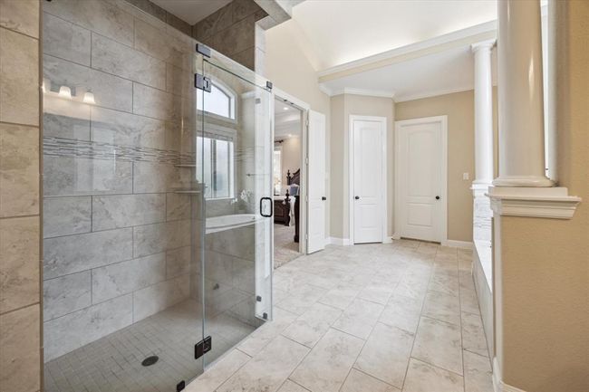 Massive frameless shower with double spouts and designer tile all the way up to the ceiling | Image 24