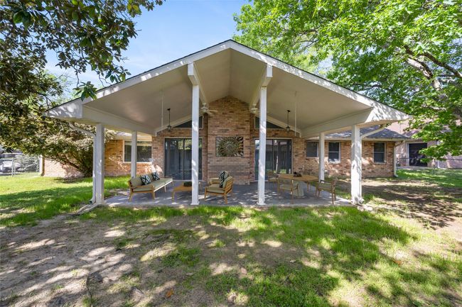 Back of property featuring brick siding, a patio, and ceiling fan | Image 19