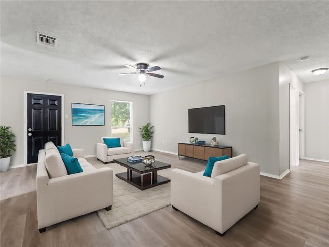 Living room and back door. | Image 4