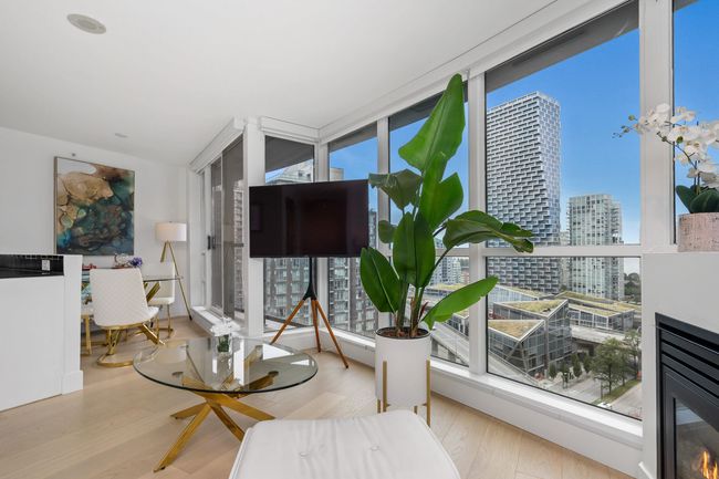 Balcony featuring a view of city and a glass covered fireplace | Image 20