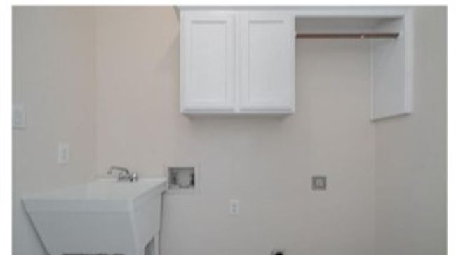 Laundry area with washer hookup and cabinet space | Image 13