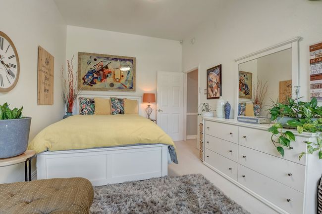 Bedroom #4 offers a large walk-in closet and backyard views | Image 22