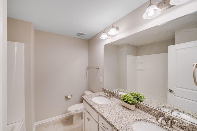 Secondary upstairs bath off hall. | Image 32
