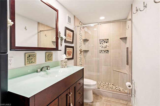 Bathroom with a stall shower, vanity, and recessed lighting | Image 25
