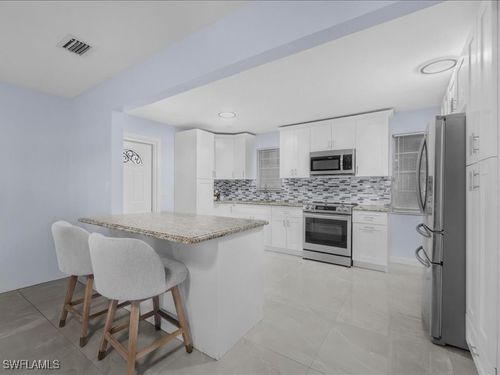 77 Glenmont Dr W, NORTH FORT MYERS, FL, 33917-4115 | Card Image