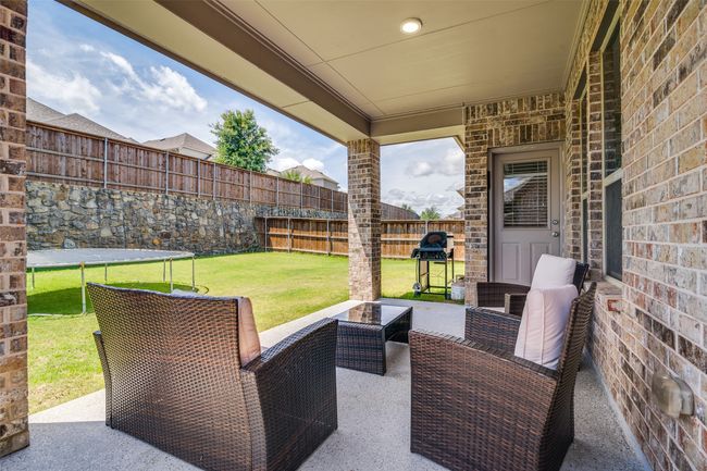 View of patio with grilling area and outdoor lounge area | Image 26