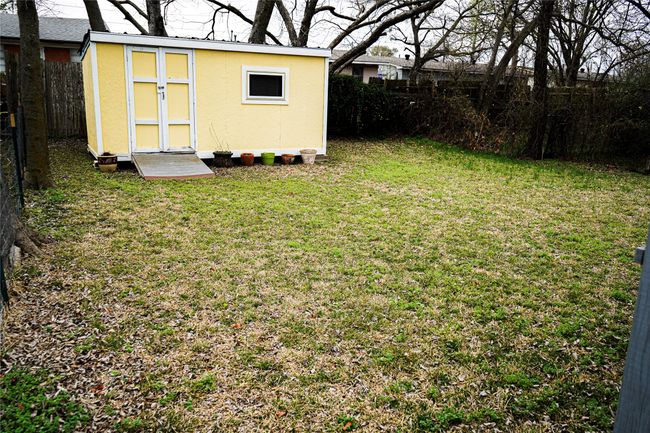 View of yard with an outbuilding, a storage unit, and a fenced backyard | Image 22