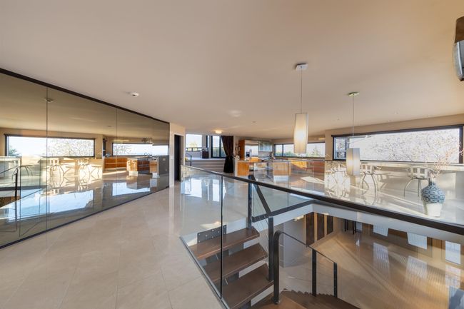 Stairway with a wealth of natural light and tile patterned flooring | Image 38