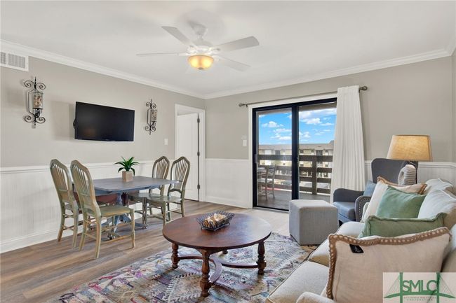 Living Room open to Kitchen & Dining Area with Sliding Glass Door to Spacious Balcony | Image 8
