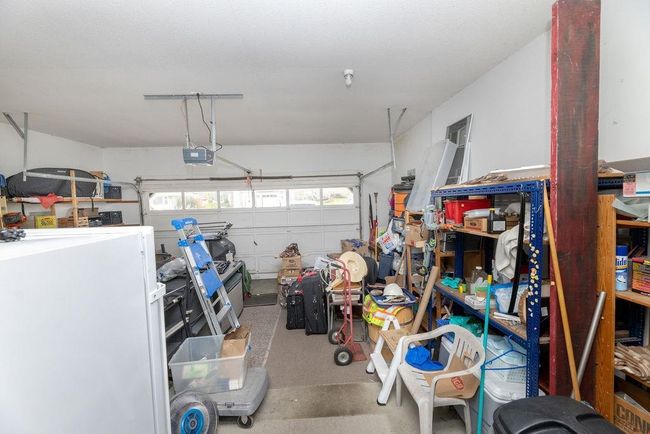 Garage featuring a garage door opener | Image 26
