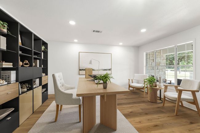 Versatile space ideal for a home office or dining area, featuring ample natural light and elegant design. | Image 5