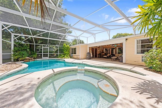 Main Home - Plenty of space for entertaining friends and family with your screened in pool and spa! | Image 55