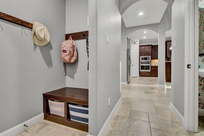 The mudroom area provides the perfect spot to drop off the backpacks after school | Image 24