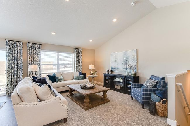 Main level living room area, enough space to accommodate many different furniture arrangements. Model home photo, colors and selections may vary. | Image 6