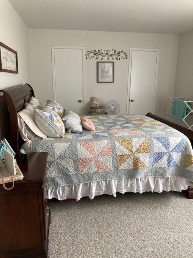 Bedroom with carpet flooring | Image 12