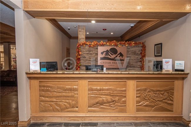 Welcome area featuring crown molding and a security system | Image 24