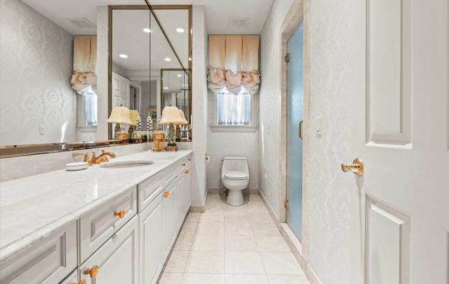 Bathroom featuring vanity, tile patterned flooring, a stall shower, toilet, and recessed lighting | Image 22