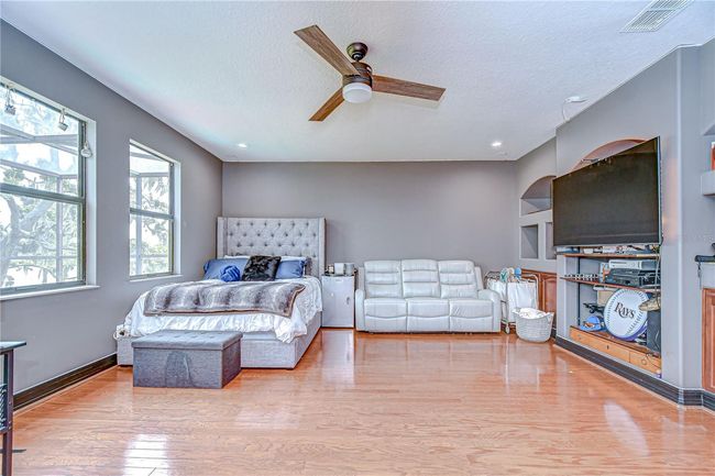 Media room offers oh so much space with pool & lake views and direct access to the balcony that you share with one bedroom! | Image 23