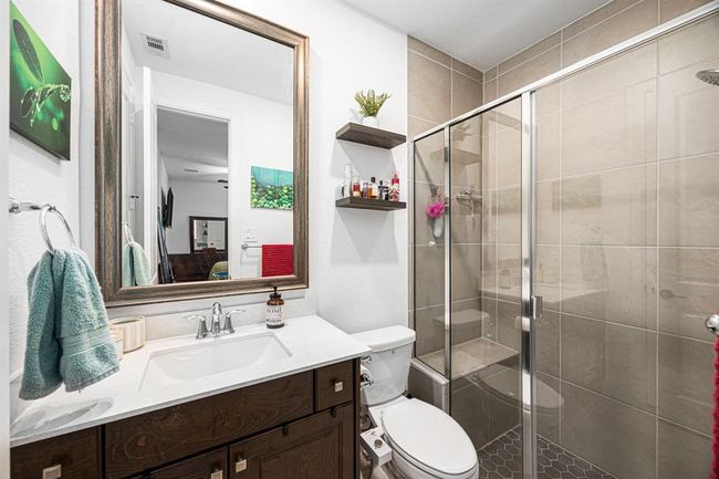 Ensuite bathroom with large walk-in shower and sit down bench. | Image 29