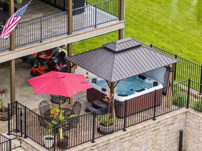 Hot tub and gazebo convey with sale of home. | Image 80