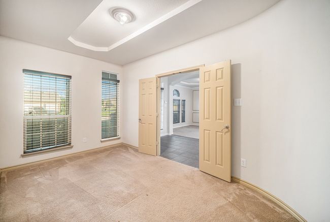 Empty room featuring carpet floors and baseboards | Image 12