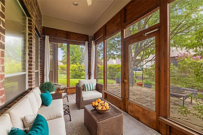 Sunroom / solarium with an outdoor living space | Image 21