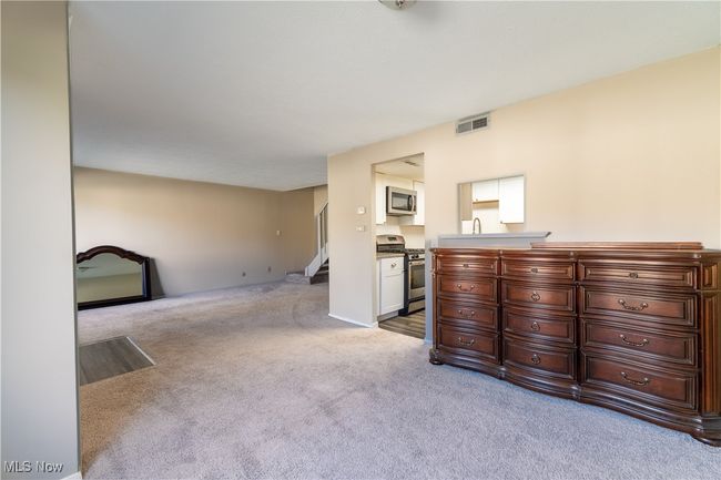 Carpeted bedroom with visible vents | Image 4