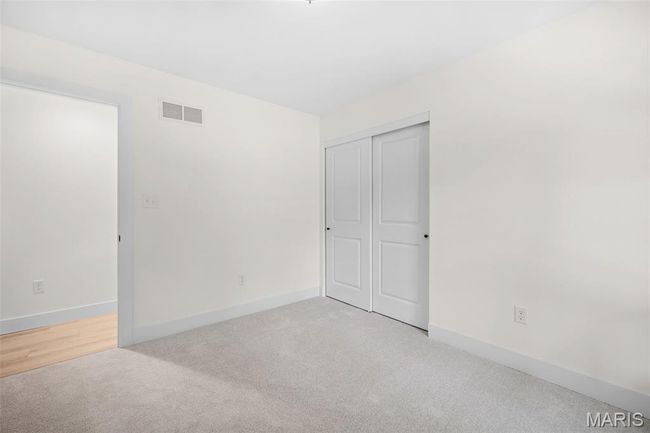 Unfurnished bedroom featuring light colored carpet and a closet | Image 29