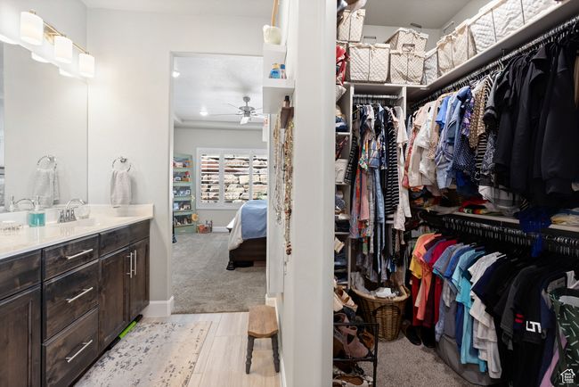 Walk in closet with ceiling fan and a sink | Image 30