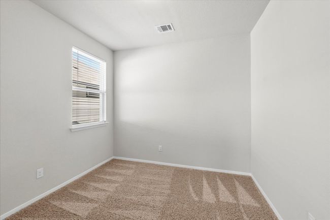 Carpeted spare room featuring visible vents and baseboards | Image 23