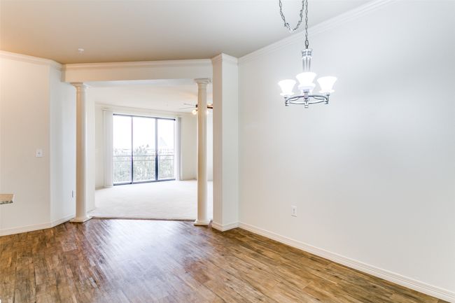 Dining area open to living area with decorative lighting | Image 5