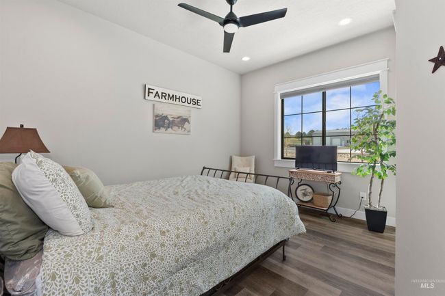 Bedroom featuring wood finished floors, recessed lighting, and a ceiling fan | Image 32