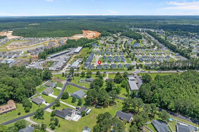Aerial view of property and surrounding area with a heavily wooded area | Image 39