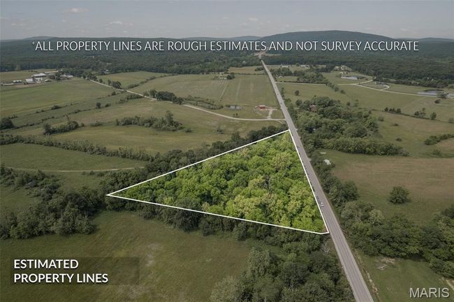 Aerial view of sparsely populated area with property boundaries highlighted | Image 45