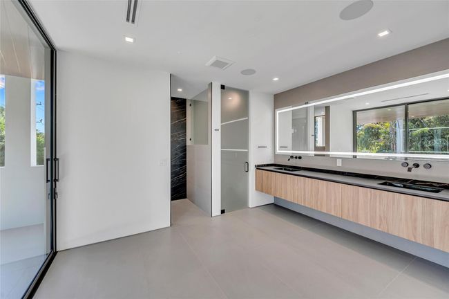 Pedini Italian Cabinetry, Porcelain Counters, Kohler Fixtures, Custom Mirror | Image 38