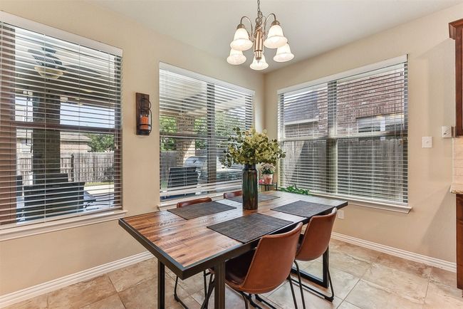 Bathed in natural light, the cozy breakfast area is the perfect spot to start your day | Image 14
