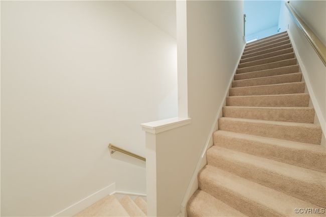 Stairs featuring baseboards and carpet | Image 6